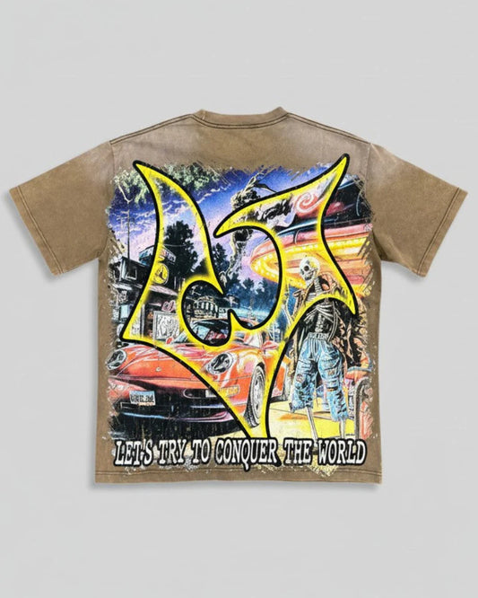 Vtilted "FANTASY" oversized graphic tee in Brown Wash — a vintage Porsche 911 idling under neon at a roadside diner with a skeleton attendant — pure pulp-fiction night