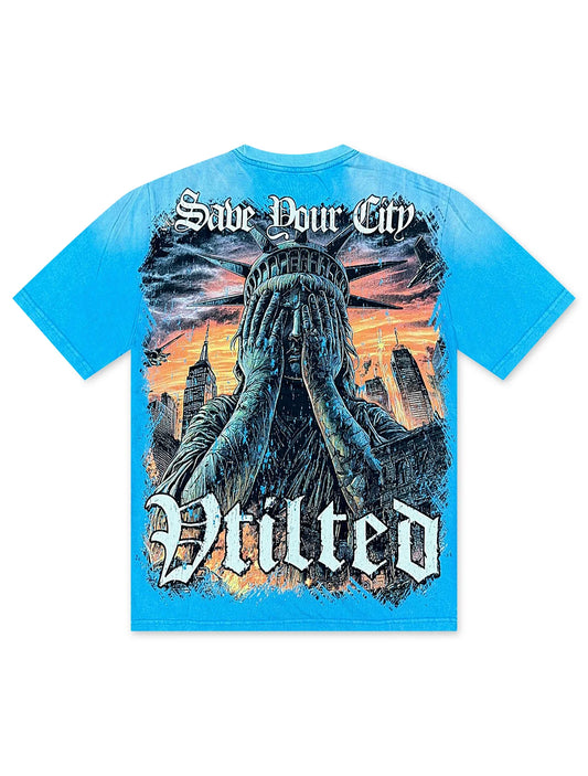 Vtilted "TEARS" oversized graphic tee in Washed Blue — a weeping faceless figure crying into their hands against a burning landscape, captioned "MADE FROM PAIN" and "THE FUTURE IS