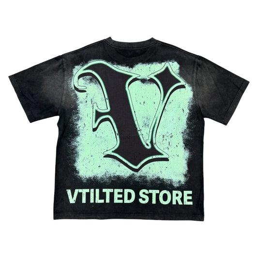 Vtilted "V STORE" oversized graphic tee in Black Wash — a moonlit Vtilted storefront at the corner of a quiet street with a lone figure entering, captioned "NO CRIME, NO CHALLENGE"