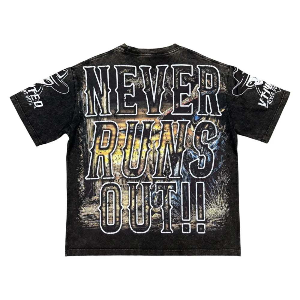 Vtilted "WILDWEST" oversized graphic tee in Heavy Black Wash — a skeleton outlaw on horseback charging across the plains at sunset, captioned "NEVER RAINS ON US"