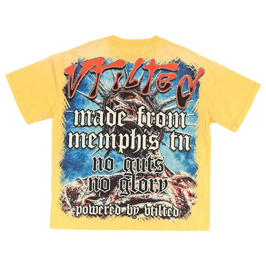 Vtilted "GLORY" oversized graphic tee in Mustard — a Statue of Liberty skull screaming at a stormy sky with "NO GUTS NO GLORY" and "Made From Memphis" in distressed Old En