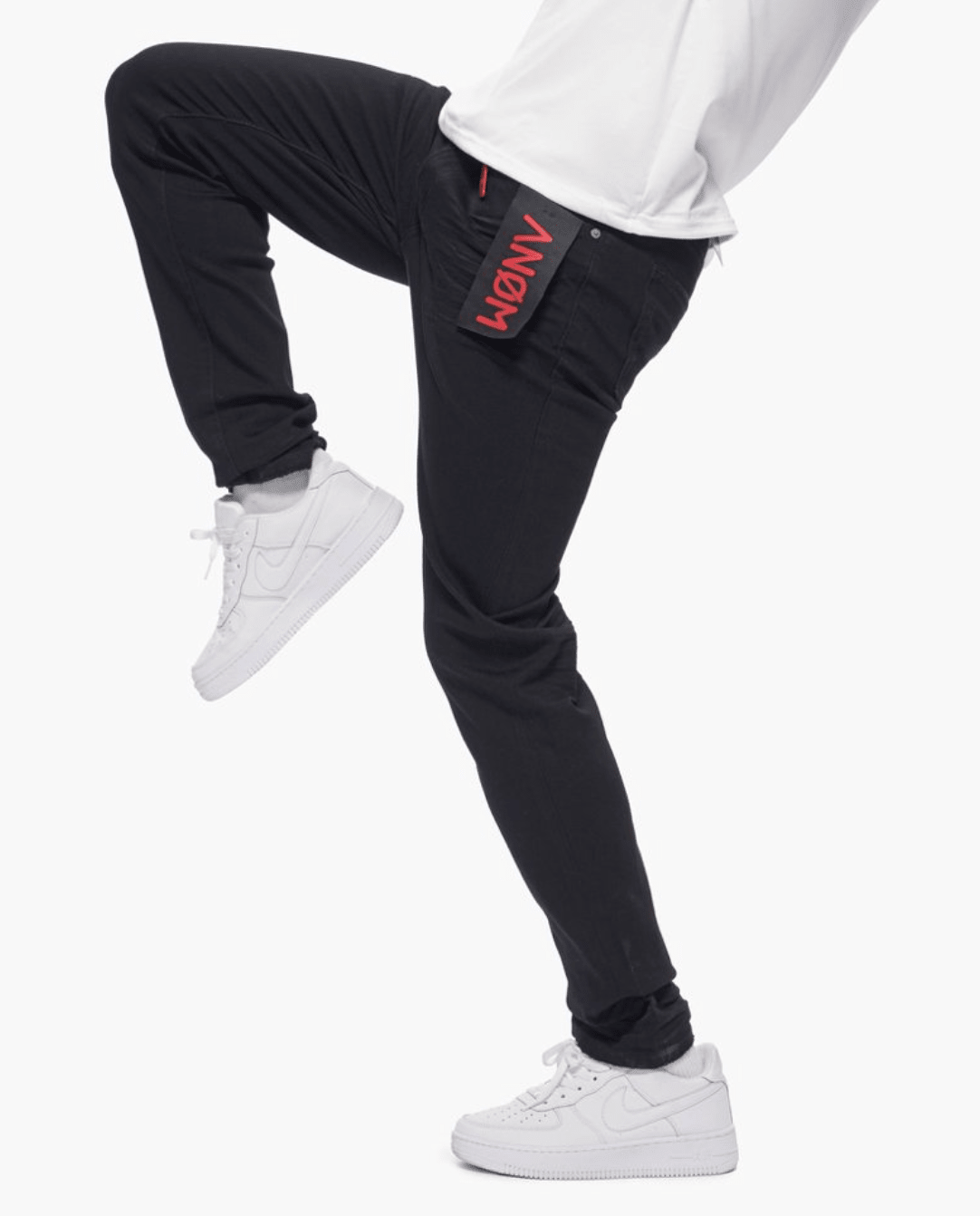 Anom 360 Skinny in Jet Black - solid jet-black stretch denim skinny jean with clean unfaded finish and red Anom flag patch