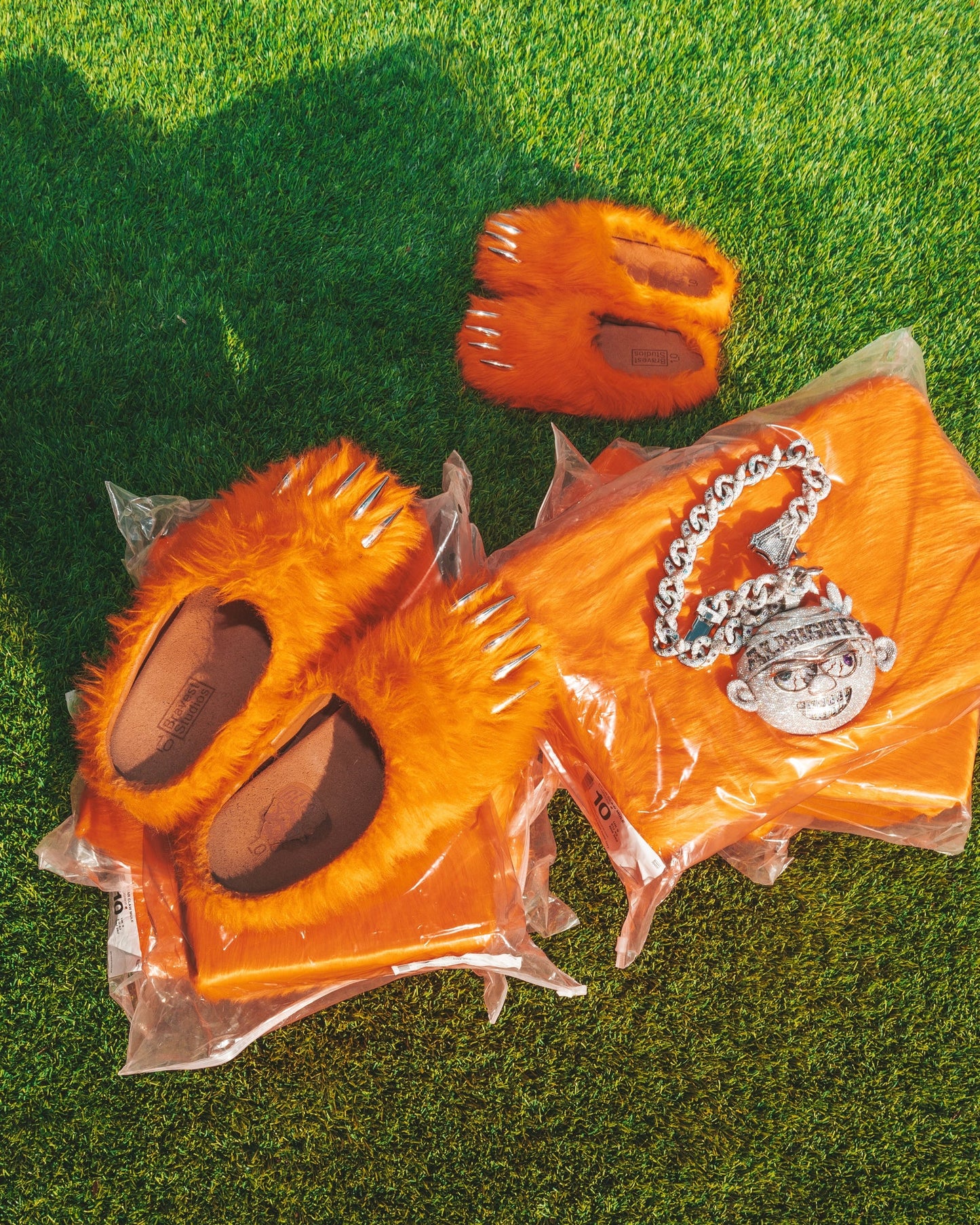 Bravest Studios Bravest Studios x Chief Keef x Glo Gang - Bear Claw Mule - Glorange — Bravest Studios cult mule with viral motif, sandal, side profile