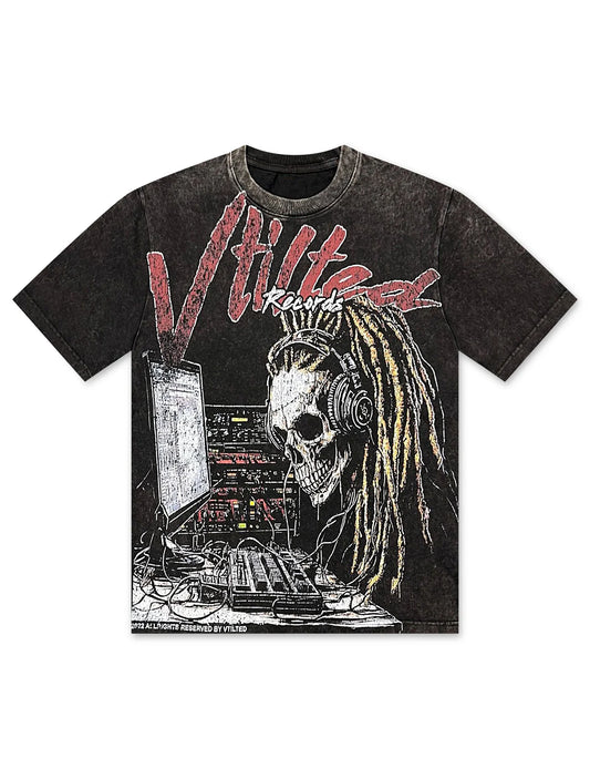 Vtilted "RECORDS" oversized graphic tee in Heavy Black Wash — a dreadlocked skeleton at a vintage mixing console under "VTILTED RECORDS" in graffiti-script — the imprint making the noise