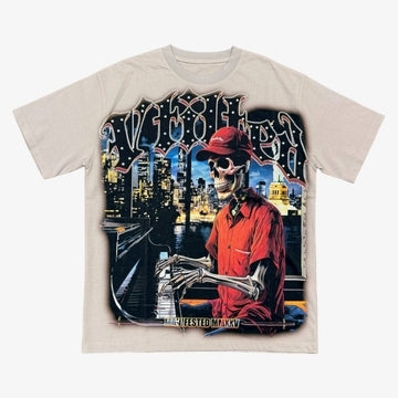 Vtilted "MANIFESTED" oversized graphic tee in Gray — a sharp-dressed skeleton in a red coat against a glowing city skyline, marked "MMXV" — a manifestation icon from the Vtilted mytho